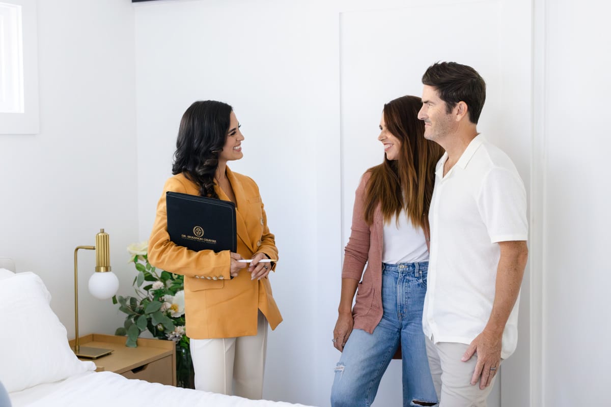 Therapist Speaking to Couple in Consultation Room