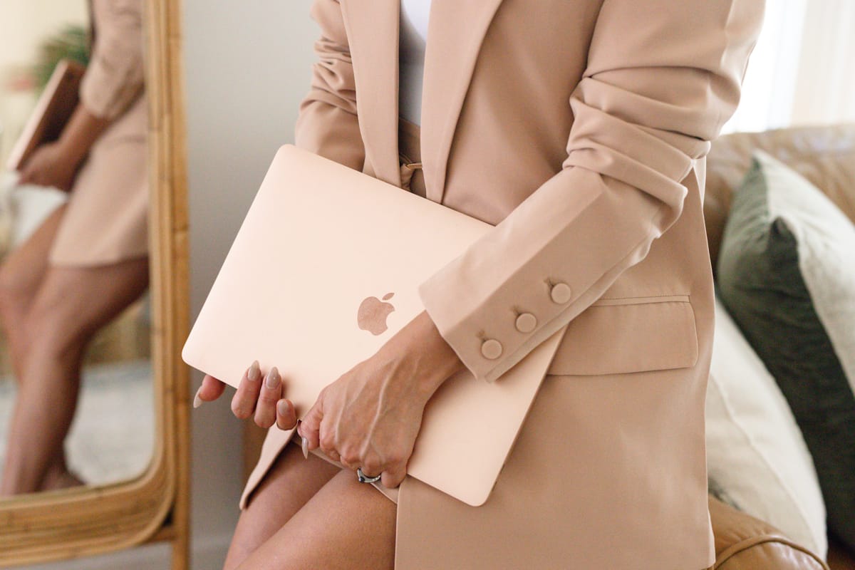 Hands Holding Apple Notebook