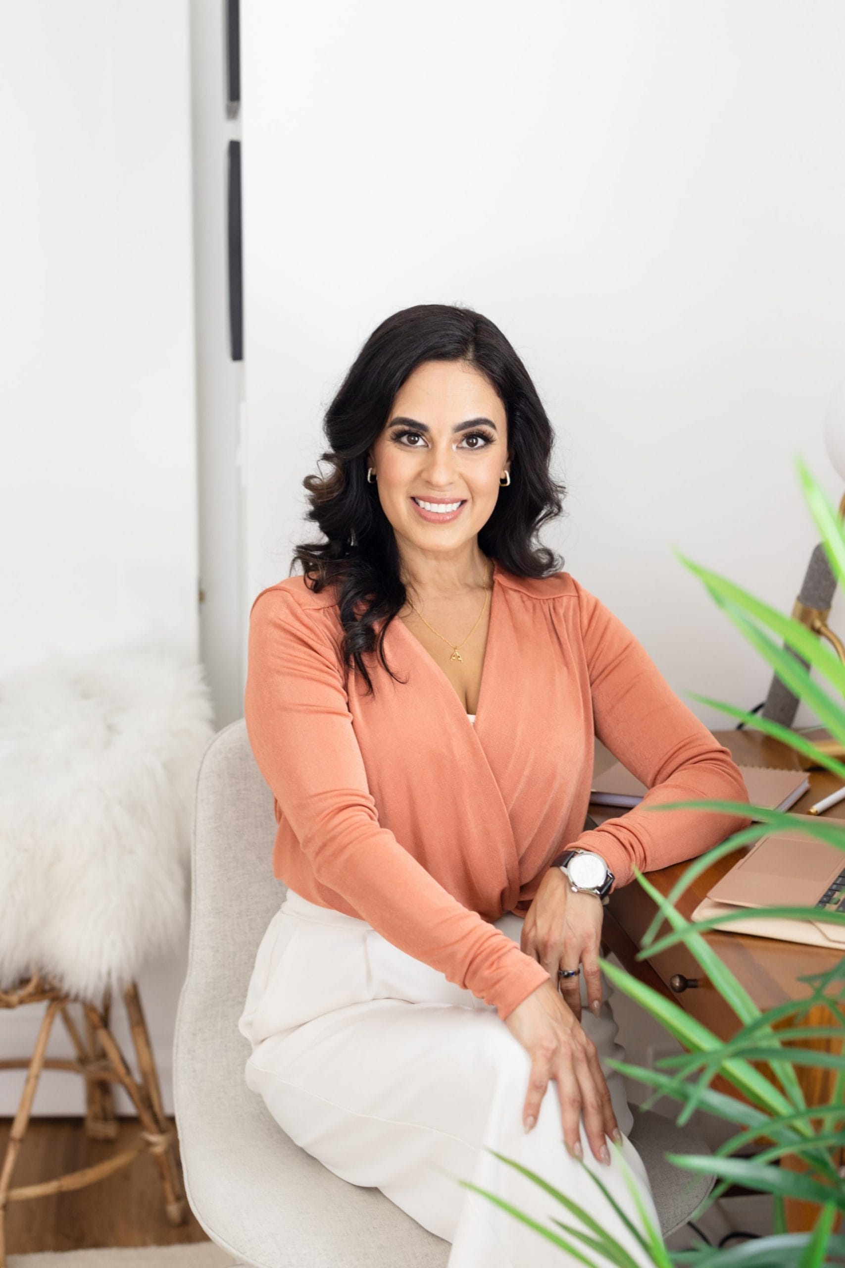 A profile photo of Dr. Shannon Chavez seated on a chair.