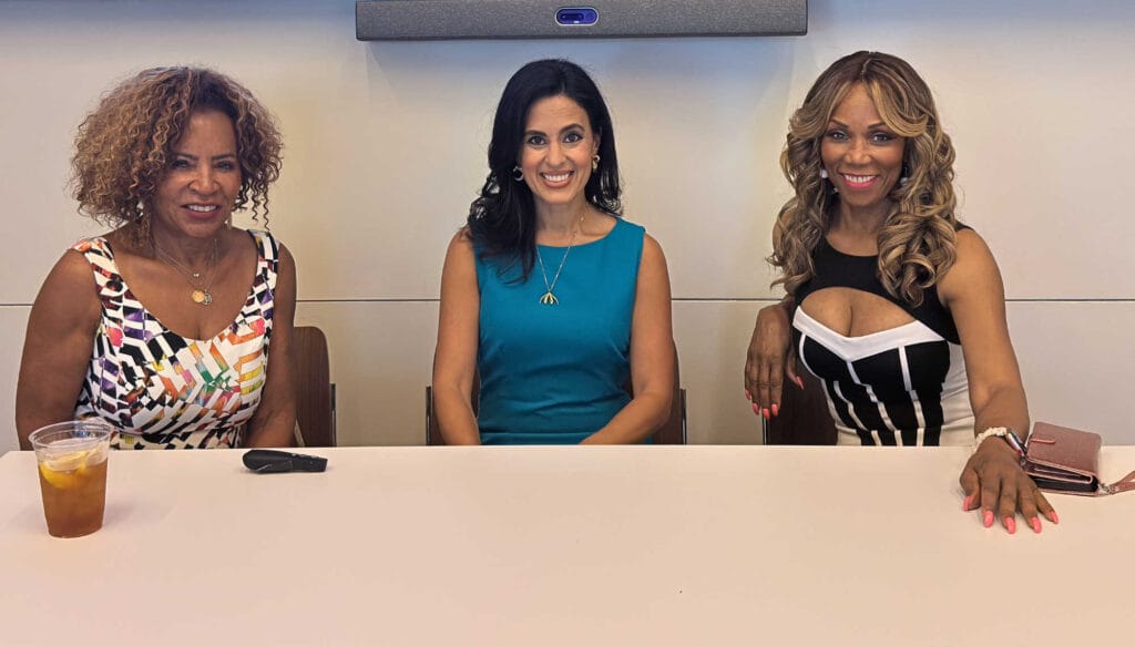 Doctor Gail Jackson (left), Doctor Shannon Chavez (center), and Wendy Ida (right) seated on stage at the Black Women for Wellness event in Los Angeles, speaking on women’s health, sexual wellness, and empowerment.