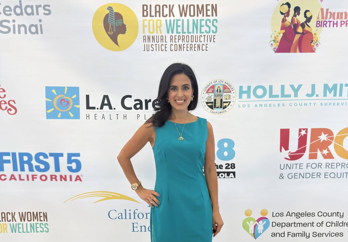 Doctor Shannon Chavez posing at the Black Women for Wellness event in Los Angeles, representing sexual wellness and women’s health advocacy.