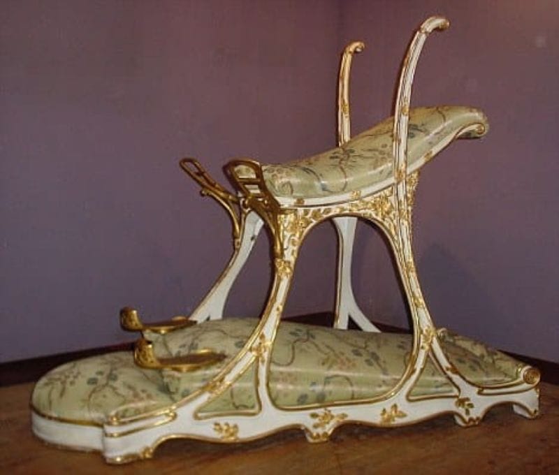 An ornate 19th-century love chair crafted for King Edward VII by Louis Soubrier for use at Le Chabanais brothel in Paris.