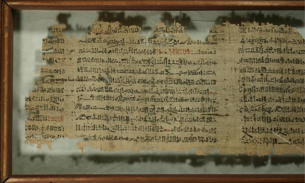 Papyrus fragment containing the ancient Egyptian Love Songs from Deir el-Medina, written in hieratic script, celebrating romance and sensual longing.